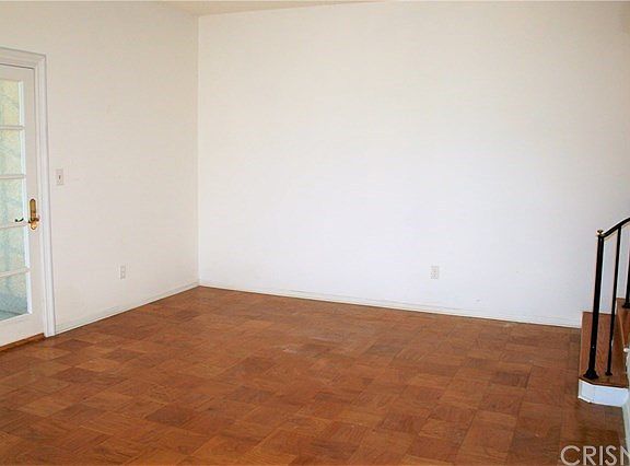 Looking from the fireplace to the other end of the living room, giving you an idea of the size.