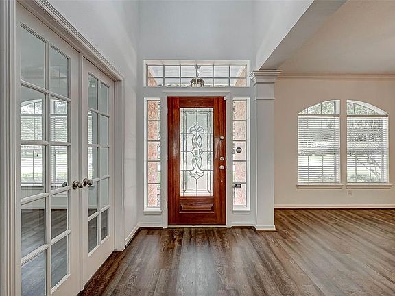 Front entry; neutral interior; vinyl wood plank flooring throughout all living areas