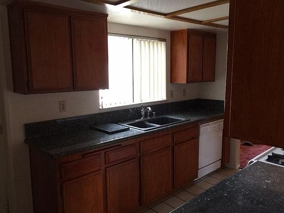 Kitchen sink and dishwasher w/ window.