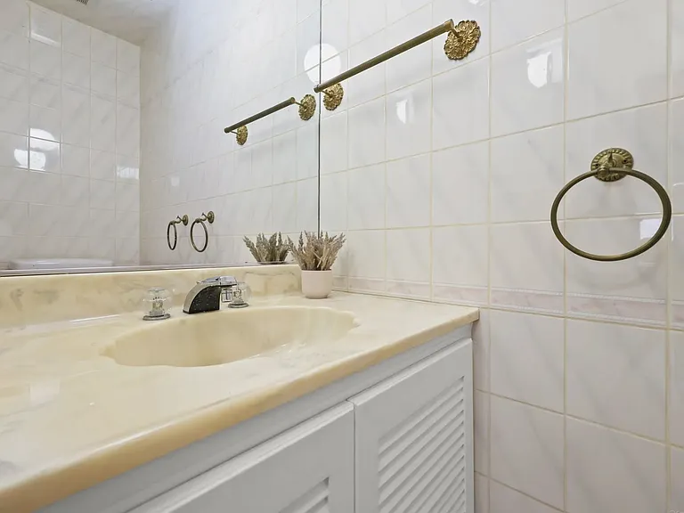 This is the private half bathroom. This bathroom does not have a shower or tub.