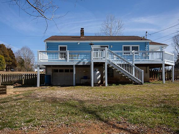View from the fenced-in backyard. There is tons of storage beneath the house.