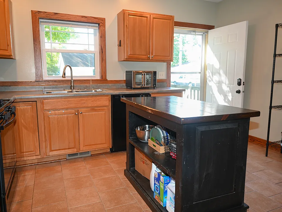 Large kitchen that includes a dishwasher, oven, and refrigerator.