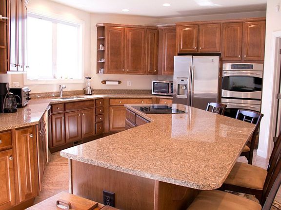 Great Island with Tall Kitchen Cabinets