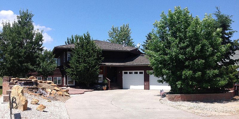 Front
						:
						Front Patio w/ Waterfall, 2 car Gar. On the 6th Fairway of Red Lodge Golf Course