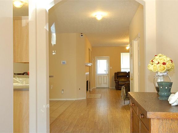 Grand Entry way with laminate flooring in the living and dinning room