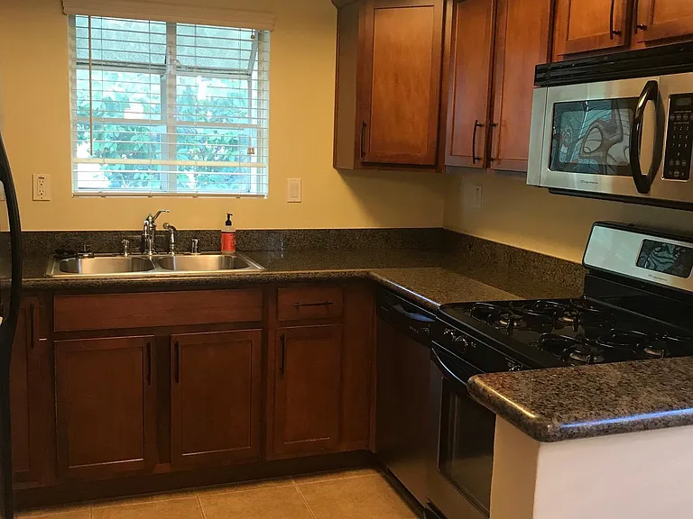 Quaint kitchen with granite countertops