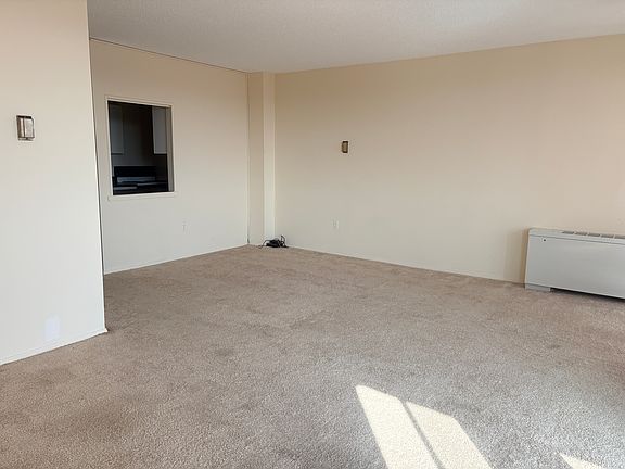 Interior photos taken before new carpeting and fresh paint.