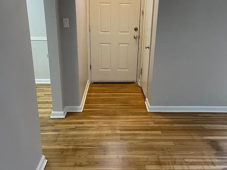 Living room looking at Front door w/ side coat closet