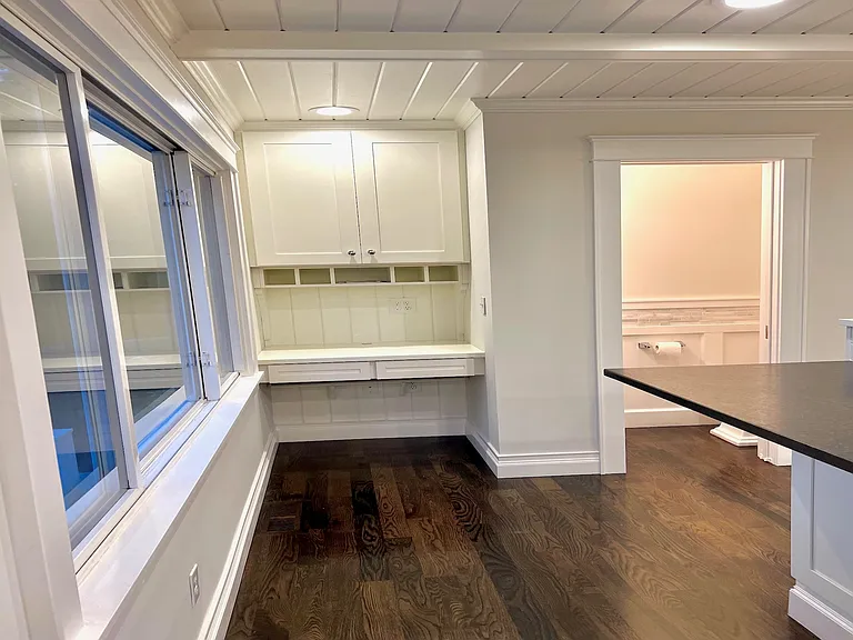 Organize your day or tackle your work at the desk tucked away by the dining area