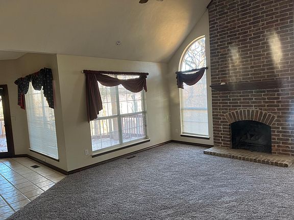 In family room looking toward fireplace and deck