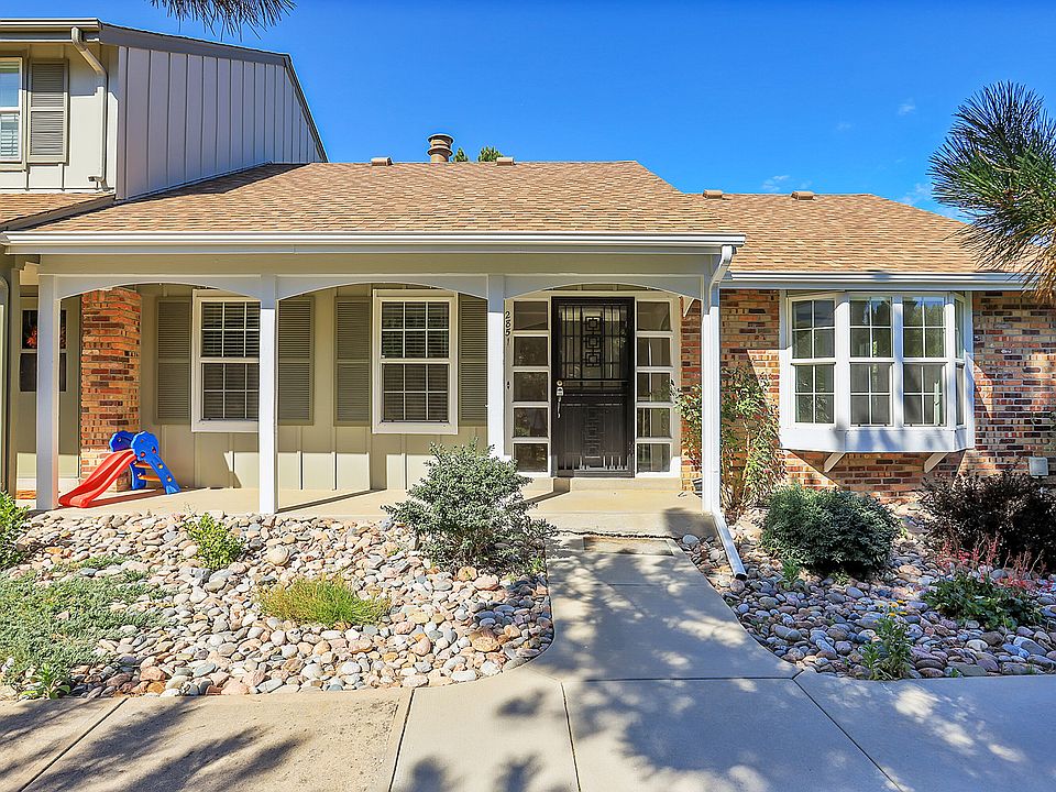 Inviting end-unit with private entry, attached garage, and easy access to community amenities.