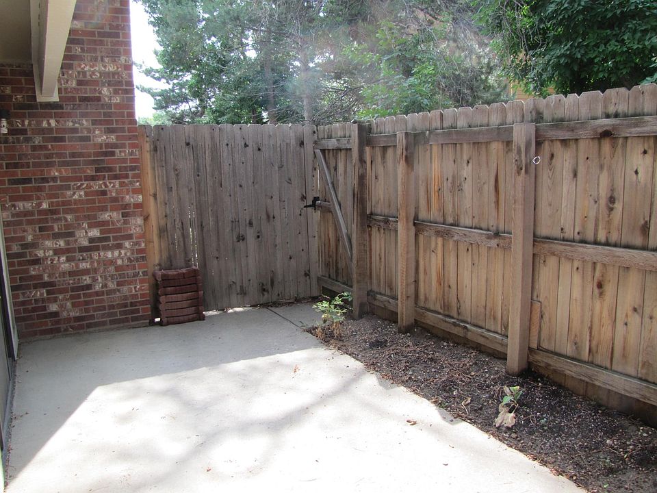 Back private patio with the gate