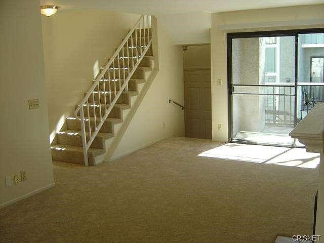 Living Room Looking To Entrance And Stairs