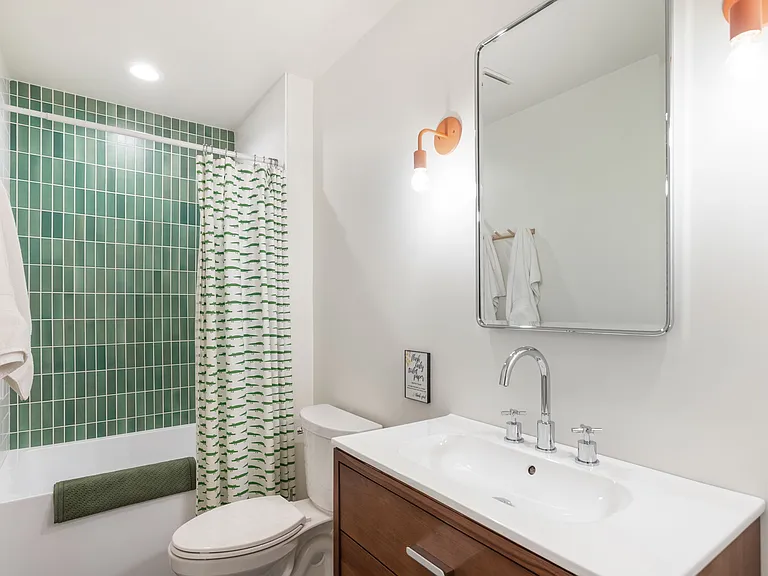 Bath/shower combo and vanity in ground floor bath
