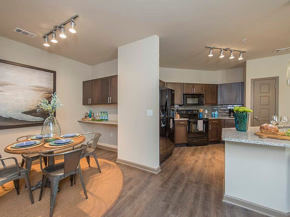 Spacious Dining Room with Work Area and View into Large Open Kitchen | Apartments in Nashville | 909 Flats