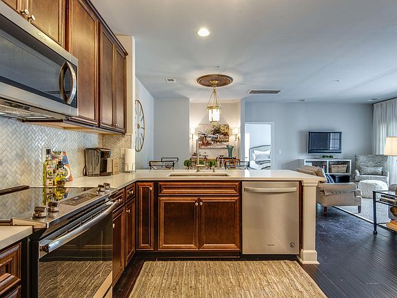 Another view of the kitchen, dining & den