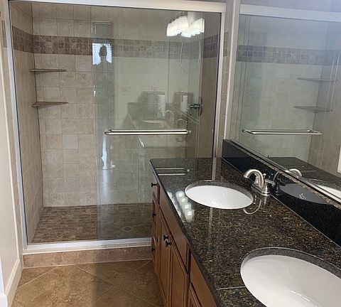 primary bathroom features dual sinks, granite counter-tops and huge shower.