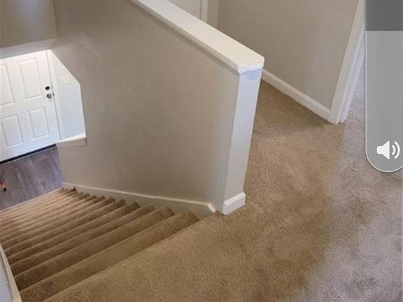 Front door leading to upstairs bedroom