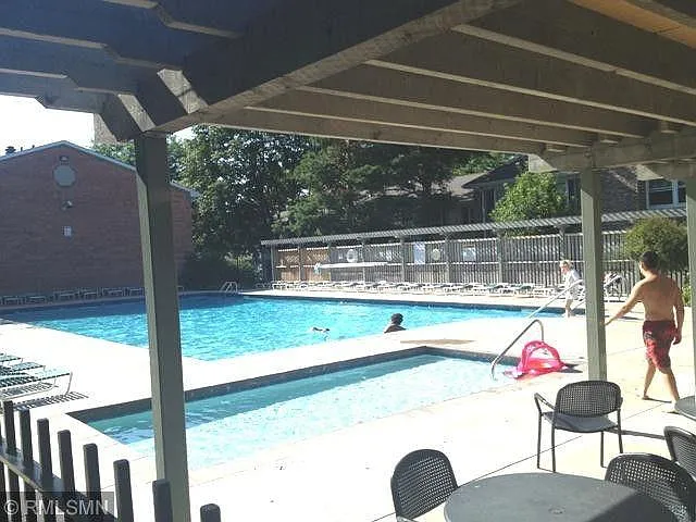 Swimming pool with kiddie pool.