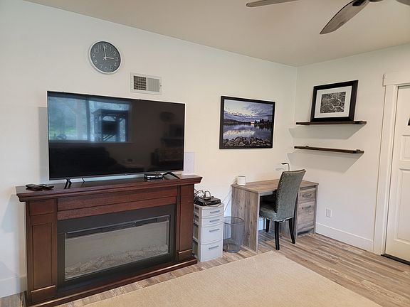 Work area, and 55" flat screen smart TV all connected to Starlink WiFi.