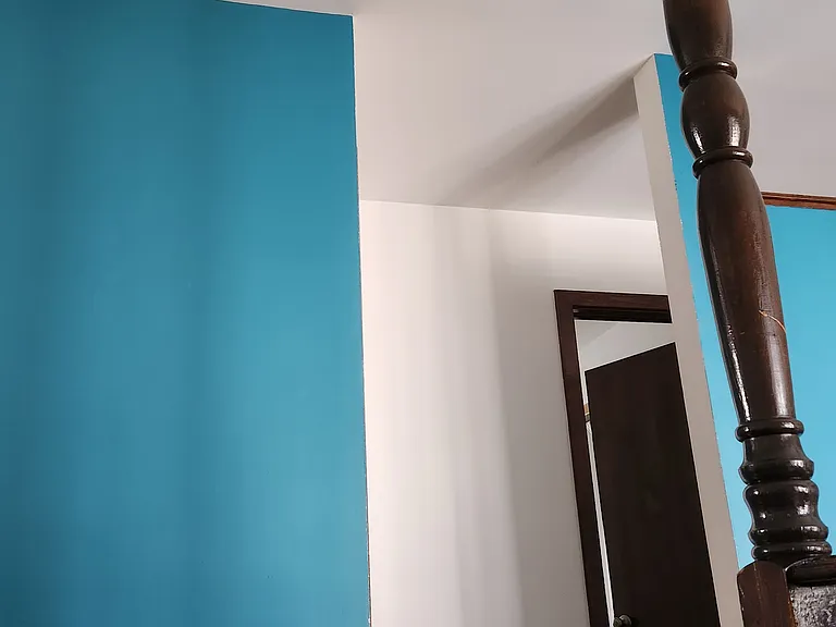Hallway door leading to bedrooms and shared full bathroom
