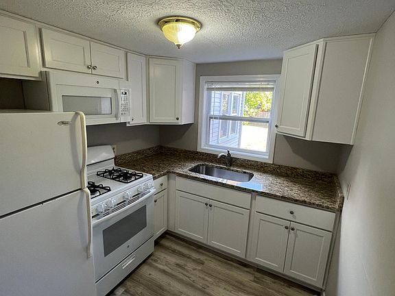 Updated Kitchen, new floors and appliances and countertops.