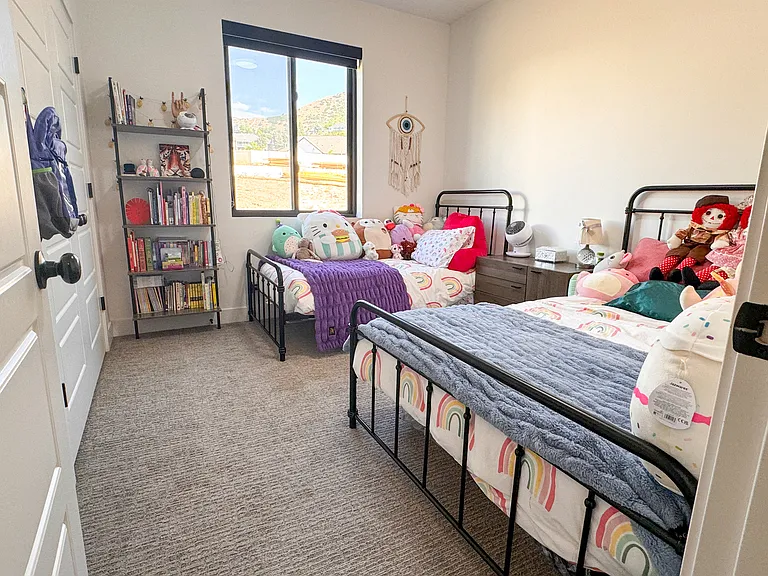 3rd floor bedroom with East facing mountain views.