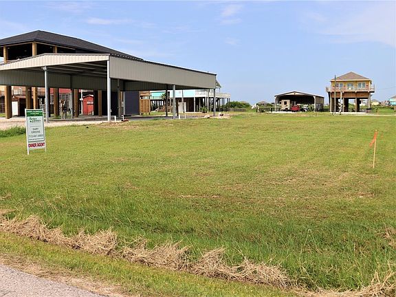 View across the lot, looking towards the direction of Hwy 87. You will notice a fair amount of home as well as RV slab(s)--which you can see in the left of the photo, which is next door to this lot