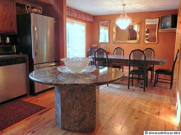 View of kitchen to dining room with wide opening.