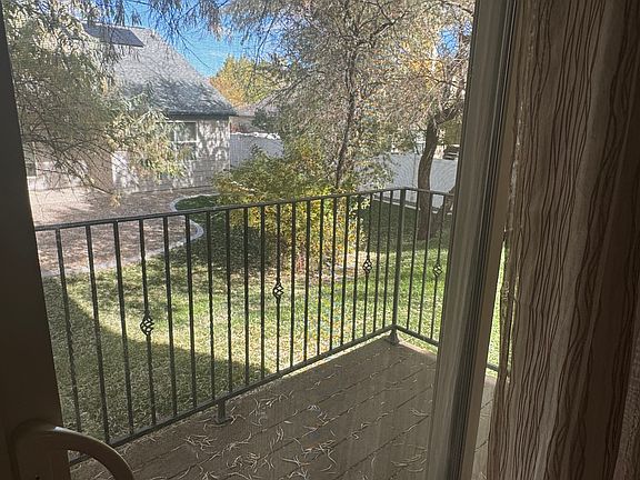 Small deck located off living room on the back side of the building (first floor)