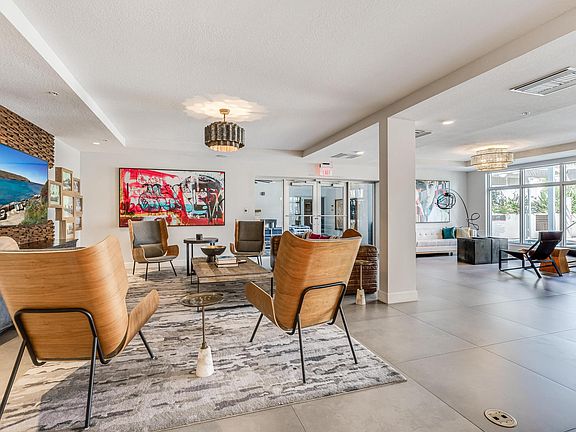 Resident Gathering Lounge with Lounge Chairs and Clubroom Access