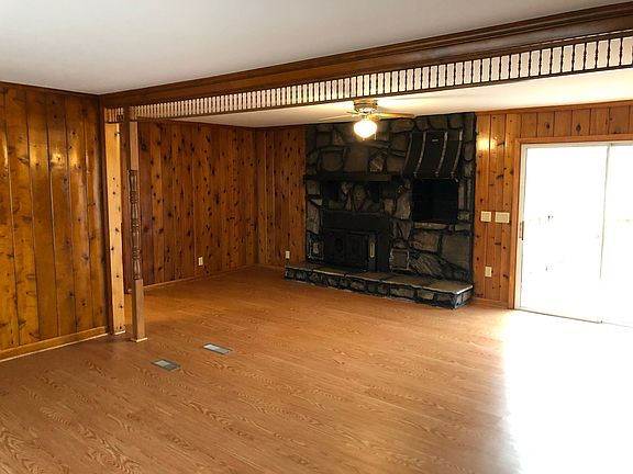 Den (new flooring and refinished walls)