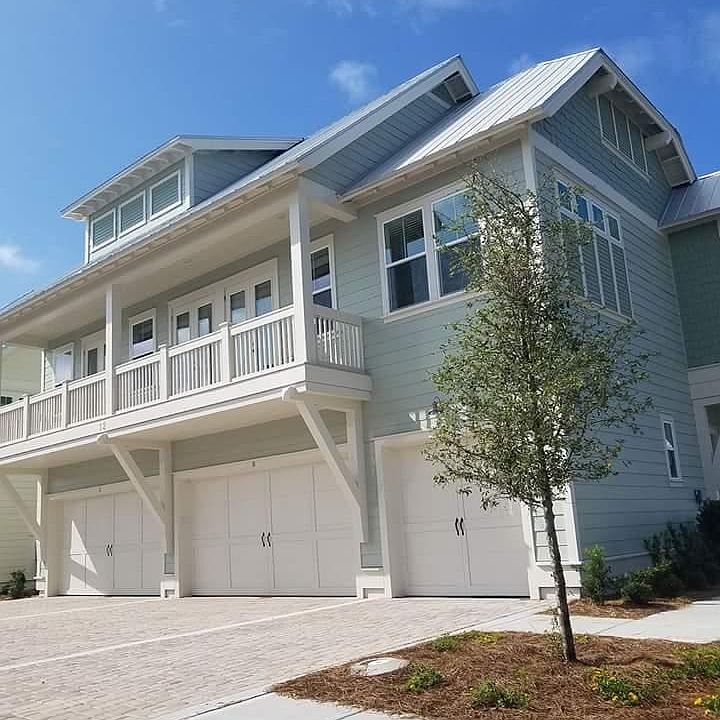 Single car garage with stairs leading to top living area of