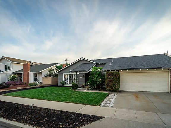 The double car garage with driveway.