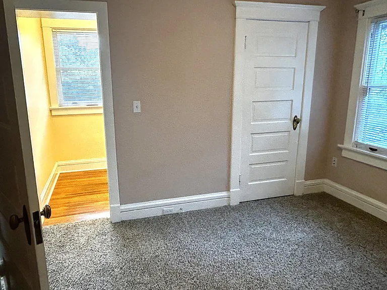 Bedroom showing 2 walk in closets. All new carpet and paint.
