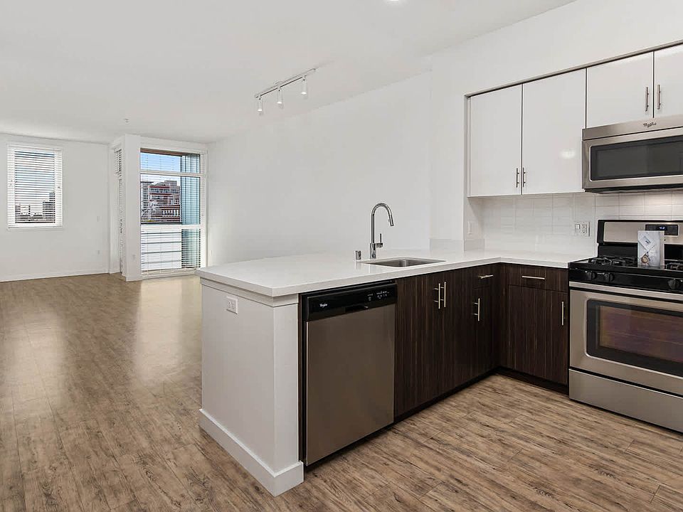 Kitchen with Quartz Countertops and Stainless Steel Appliances