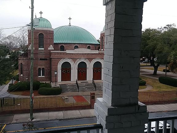 Overlooks church grounds.