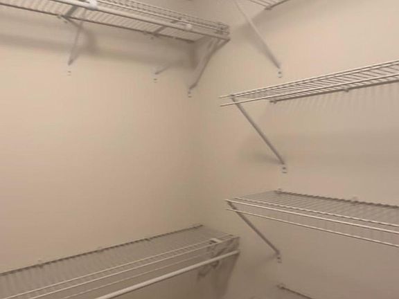 Two walk-in master bedroom closets
