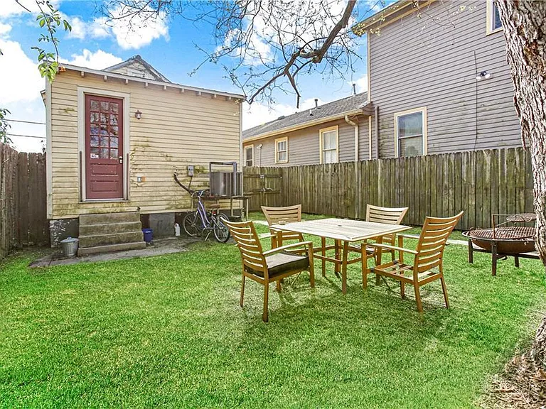 Exterior from original listing. The house and yard has been updated, and painted.
