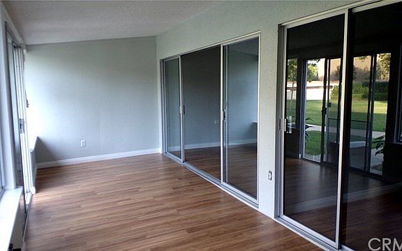 Sliding Glass Doors from living room and Bedroom to Enclosed patio