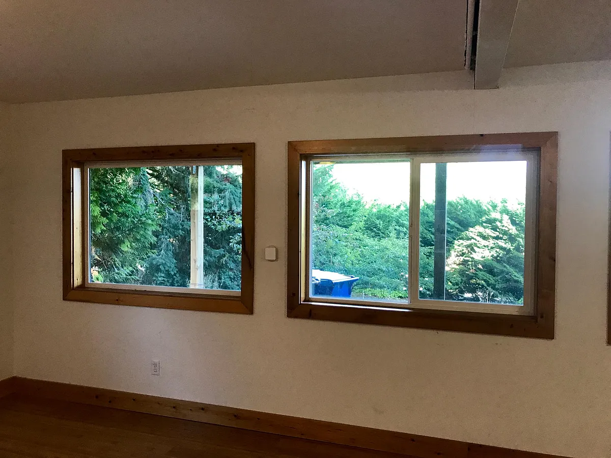 Living room facing walkway underneath upper level deck. - 6411 32nd Ave NW