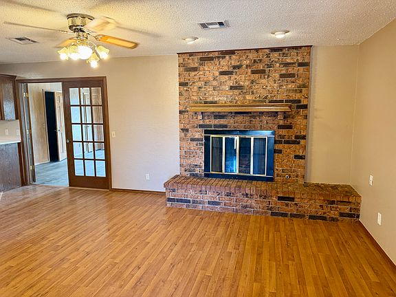 Main Living Room with Wood Burning Fireplace.