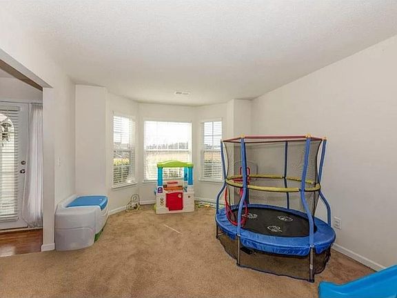 Formal living room with bay windows
