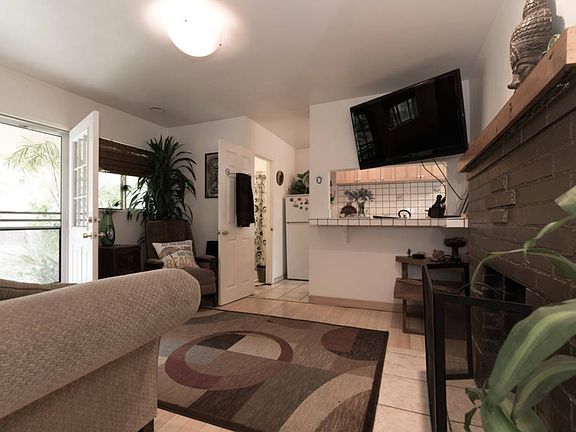 cozy open living room with fireplace