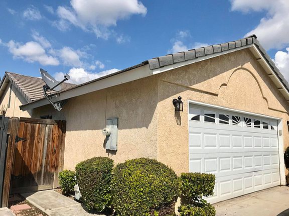 Side of house, which includes a gate to the backyard.