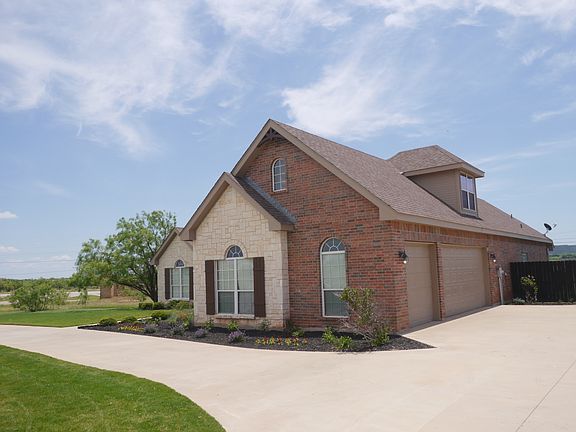 3 car garage & circle drive