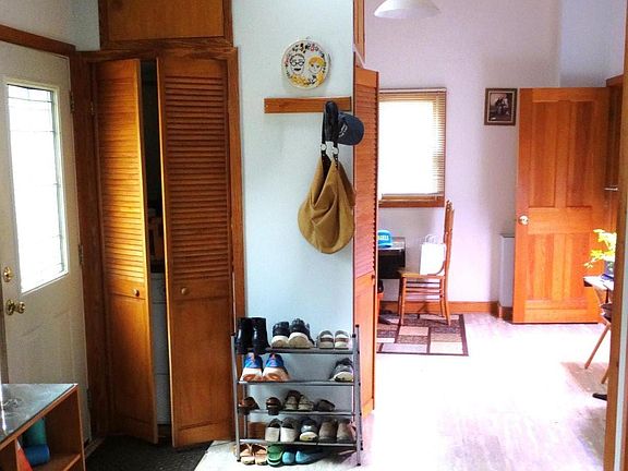 rear door entrance to kitchen, dining room and laundry closets