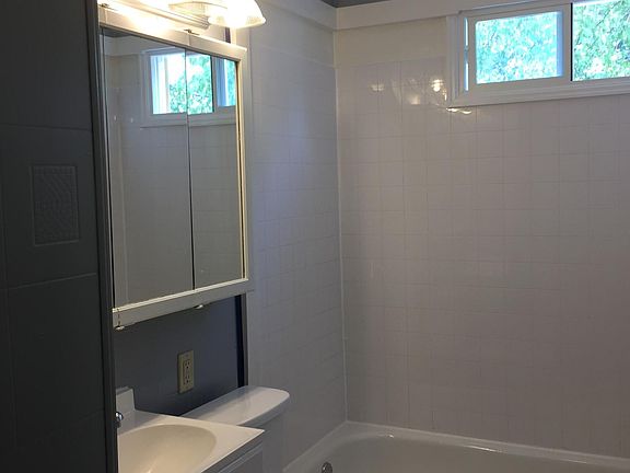 New toilet, sink, and tub surround