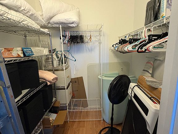 Walk in closet (This will be cleared out. Shelves included)