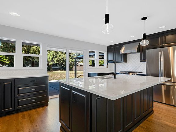 Stunning kitchen remodel. New cabinetry, countertops, designer backsplash and high end appliances.